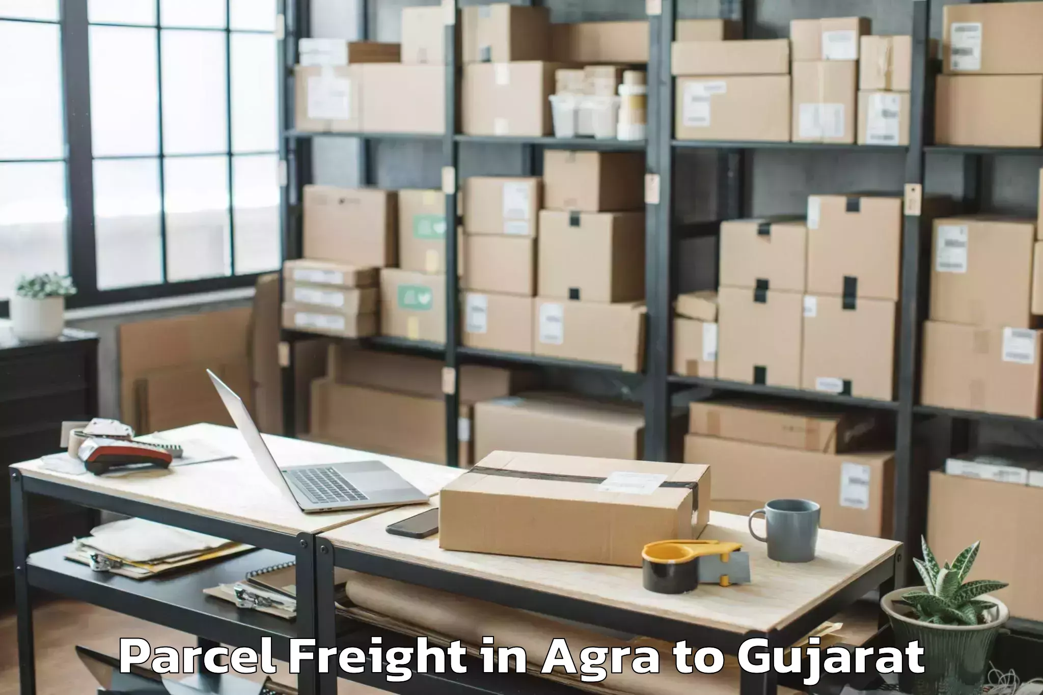 Easy Agra to Karjan Parcel Freight Booking